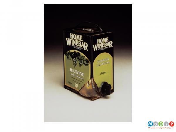 Scanned image showing a wine box with a cut-away corner to show the bag inside.