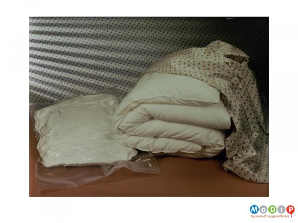 Scanned image showing a pillow in a vacuum sack.