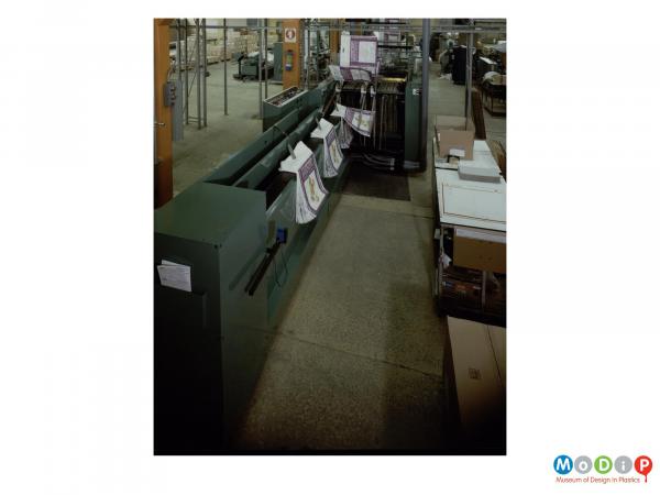Scanned image showing nappy bags on a sorting machine.