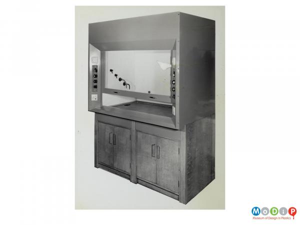 Scanned image showing laboratory cabinet.