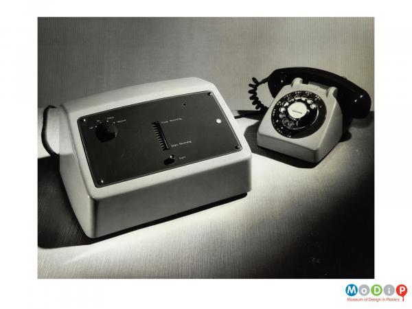 Scanned image showing a telephone and answer machine.