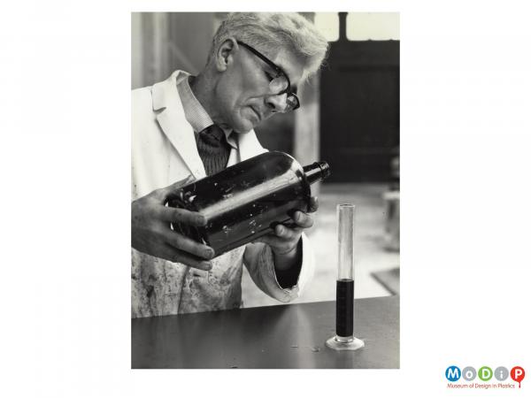 Scanned image showing a liquid being measured.