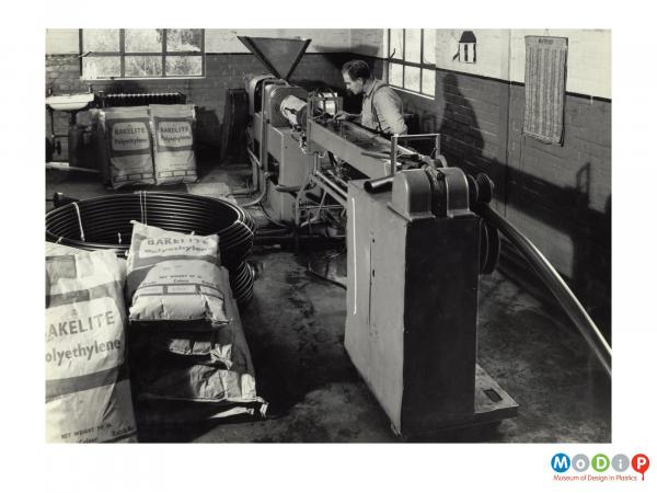 Scanned image showing pipe being extruded.