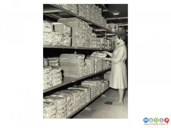 Scanned image showing products in a storeroom.