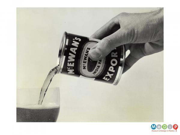 Scanned image showing a small can of beer.