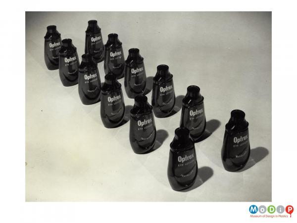 Scanned image showing 2 rows of eye lotion bottles.