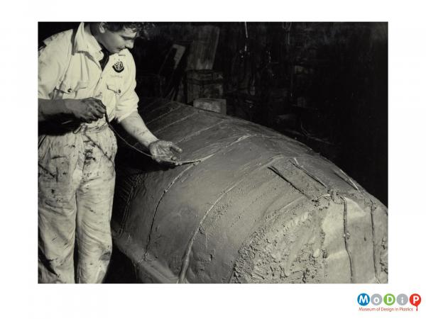 Scanned image showing the construction of a small boat.