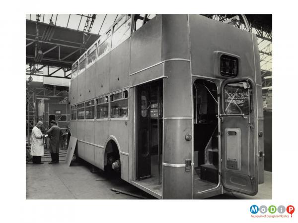 Scanned image showing parts of a double decker bus.