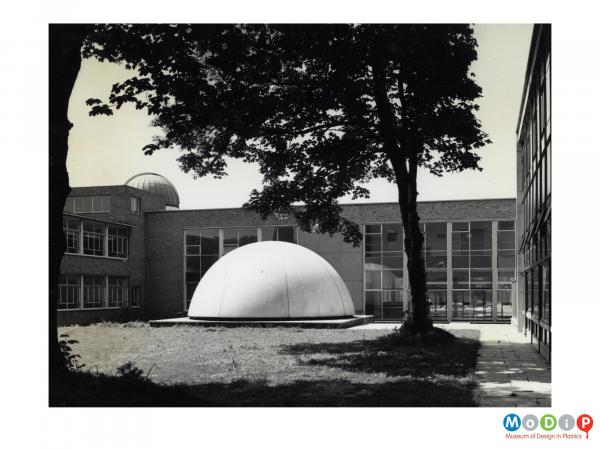 Scanned image showing the exterior of a planetarium dome.