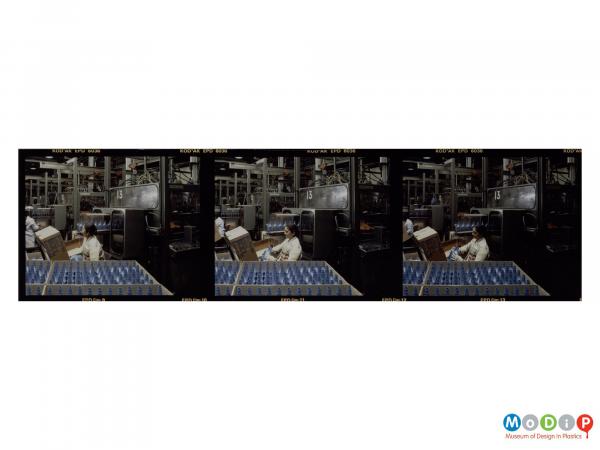 Scanned image showing a contact sheet of 3 images of a female worker quality assessing bottles from a production line.