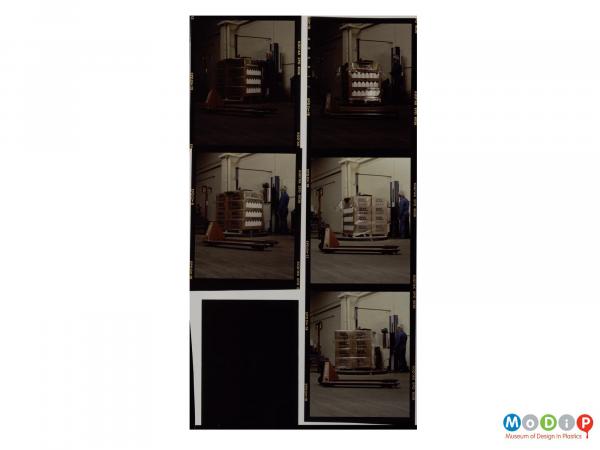 Scanned image showing a conatct sheet of 5 images of a male worker loading a pallet truck.