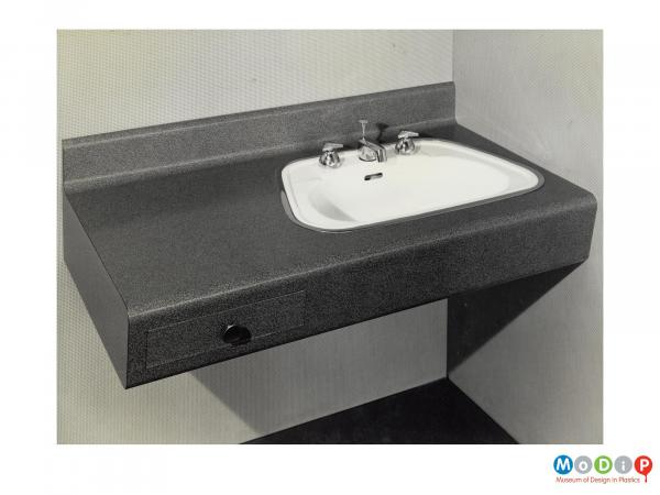 Scanned image showing a sink surround.