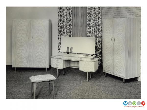Scanned image showing two wardrobes and a dressing table set.
