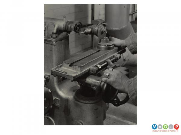 Scanned image showing a mounted tool sharpener.