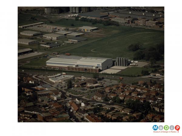 Scanned image showing an aerial view of a BXL factory.