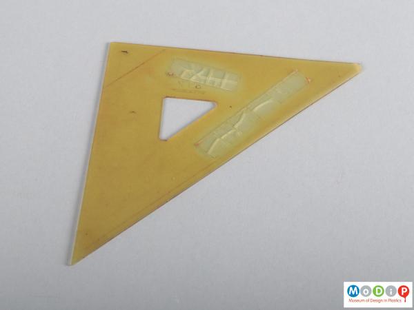 Side view of a set square showing the triangular shape.