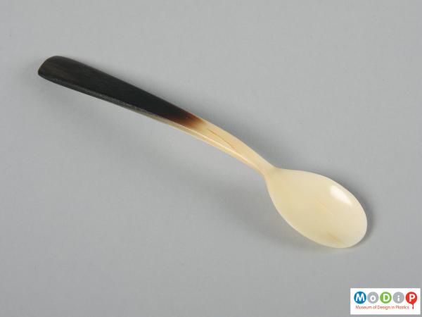 Top view of a spoon showing the bowl and handle.