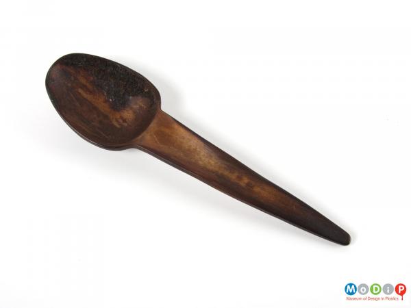 Top view of a spoon showing the bowl and handle.