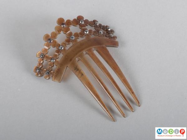 Top view of a comb showing the heading and teeth.