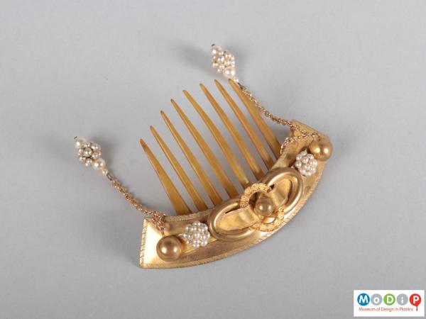 Top view of a comb showing the heading and teeth.