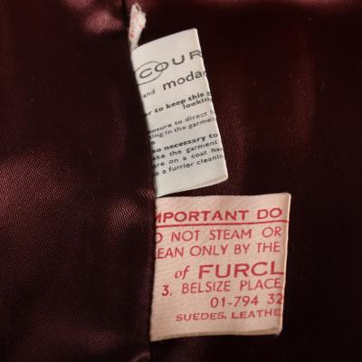 Close view of the labels of a fake fur jacket.
