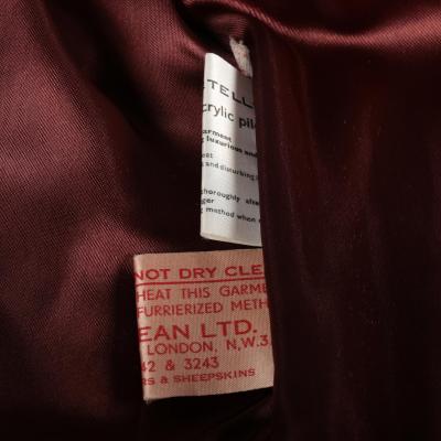 Close view of the labels of a fake fur jacket.