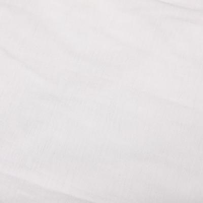 Close view of the fabric of an undershirt.