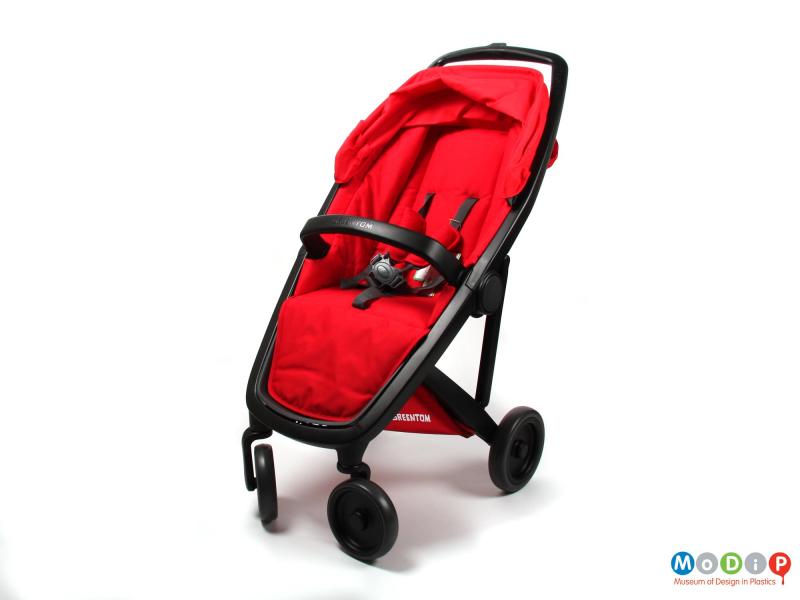 A red and black pushchair or stroller.