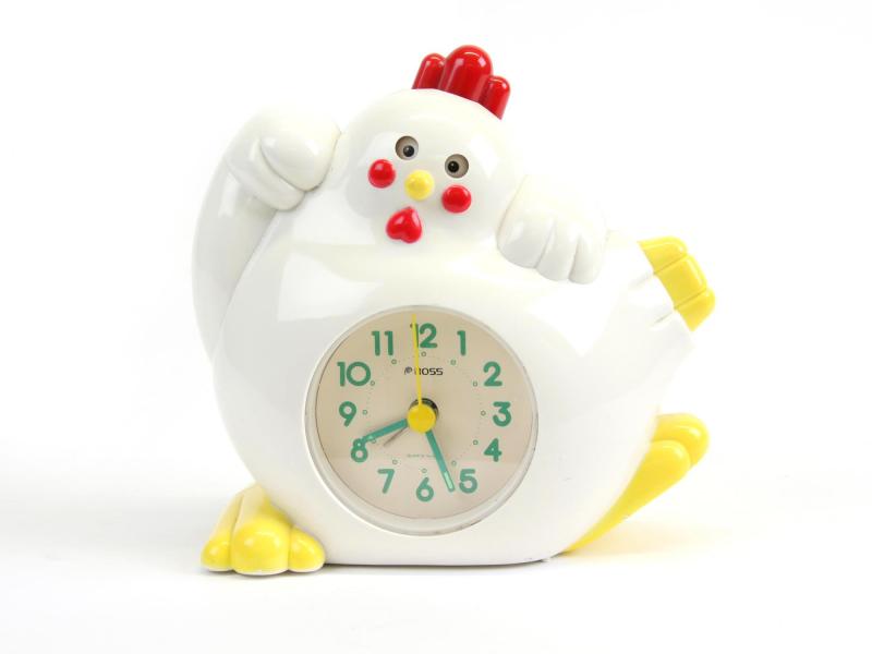 An alarm clock in the shape of a rooster.