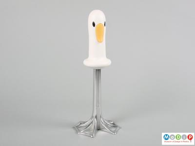 Front view of a potato masher showing the facial features of the duck.