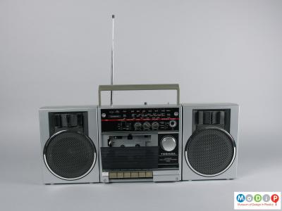 Front view of a cassette player showing the open cassette cover.