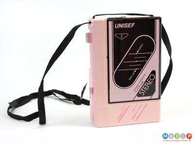Side view of a personal cassette player showing the shoulder strap.