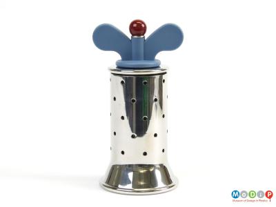 Side view of a pepper grinder showing the wing nut turnng handle.
