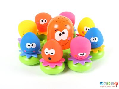 Front view of a bath toy showing all the figures sitting in place.