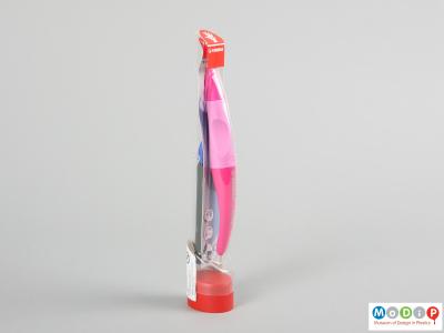 Side view of a pen showing the packaging.