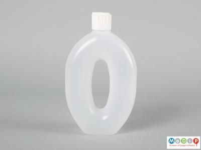 Side view of Runaid bottle showing the whole in the centre forming a handle.