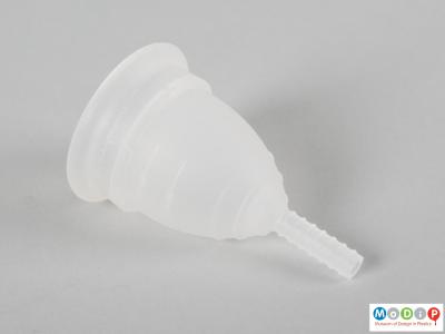 Side view of a menstrual cup showing ergonomic shaping.