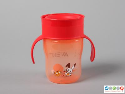 Side view of a cup showing the printed cat and rabbit design.