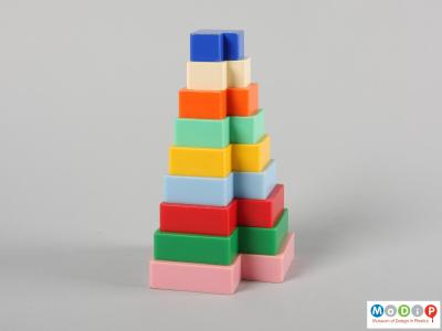 Side view of a set of stacking blocks showing the different colours.