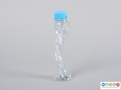 Side view of a bottle showing it twisted.