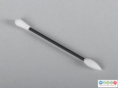 Side view of a reusable ear cleaner showing the black shaft and smooth tips.