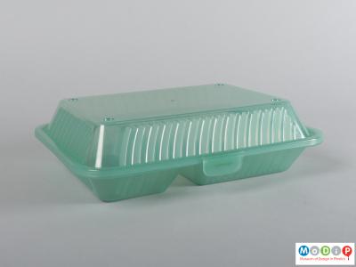 Side view of a food container showing the closed lid.