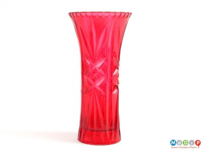 Side view of a vase showing the cut glass style patterning.
